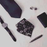 This is fashion accessories image but focued on our product ajrak pocket square along with others like tie, pen, watch, cuff lings