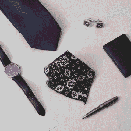 This is fashion accessories image but focued on our product ajrak pocket square along with others like tie, pen, watch, cuff lings